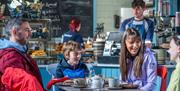 Family of four enjoying breakfast at Synge and Bryne - Kilbroney Park