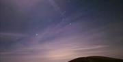 Orion's Belt visible over the night sky in Mournes