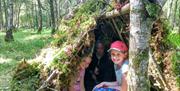Shelter building on a bushcraft session with Geology rocks summer camp