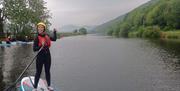 Woman smiling on a great paddle board session - Carlingford Lough