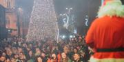 Santa switching on the Christmas tree lights in Newry City
