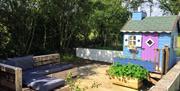 Outdoor seating area and children's playhouse