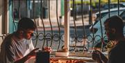 2 people enjoying pizza