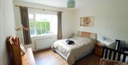 Ground floor main bedroom with large free standing cot available