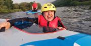 Woman smiling on a great paddle board session - Carlingford Lough