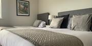 Beautifully decorated double and single bedroom with grey and white shades