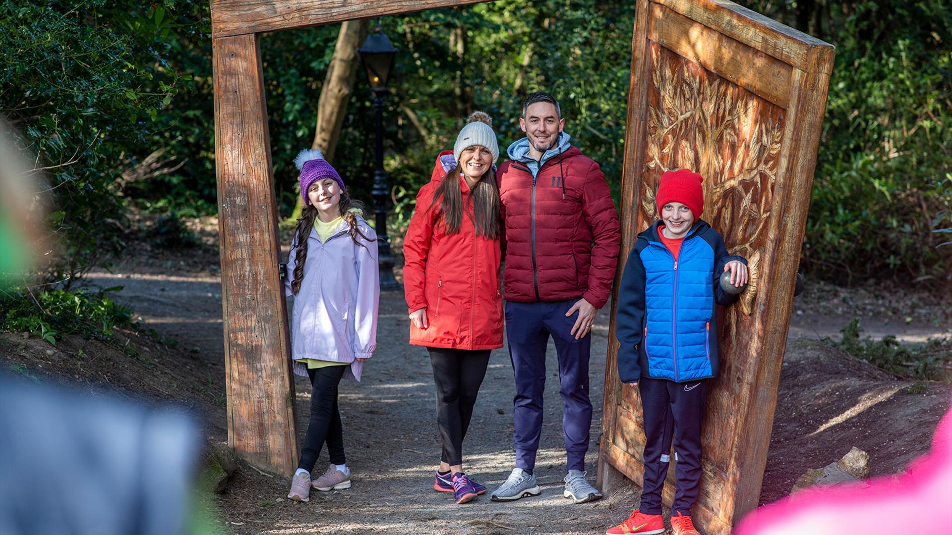 A family getting their picture taken as they walk through the wardrobe at the start of the Narnia Trail in Kilbroney Park, Rostrevor.
