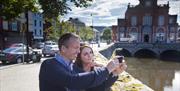 Couple taking a selfie (at Newry Town Hall) enjoying themselves on The Story of Newry Walking Tour.