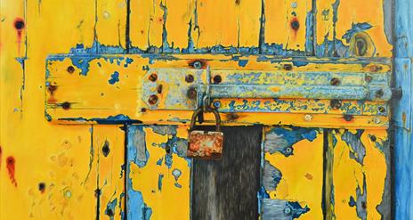 yellow gate with a lock