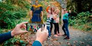 A family using the Fionn's Giant Adventure app at Slieve Gullion Forest Park.