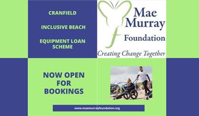 Cranfield Inclusive Beach is now open. Image showing an all-terrain wheelchair user enjoying Cranfield Beach.