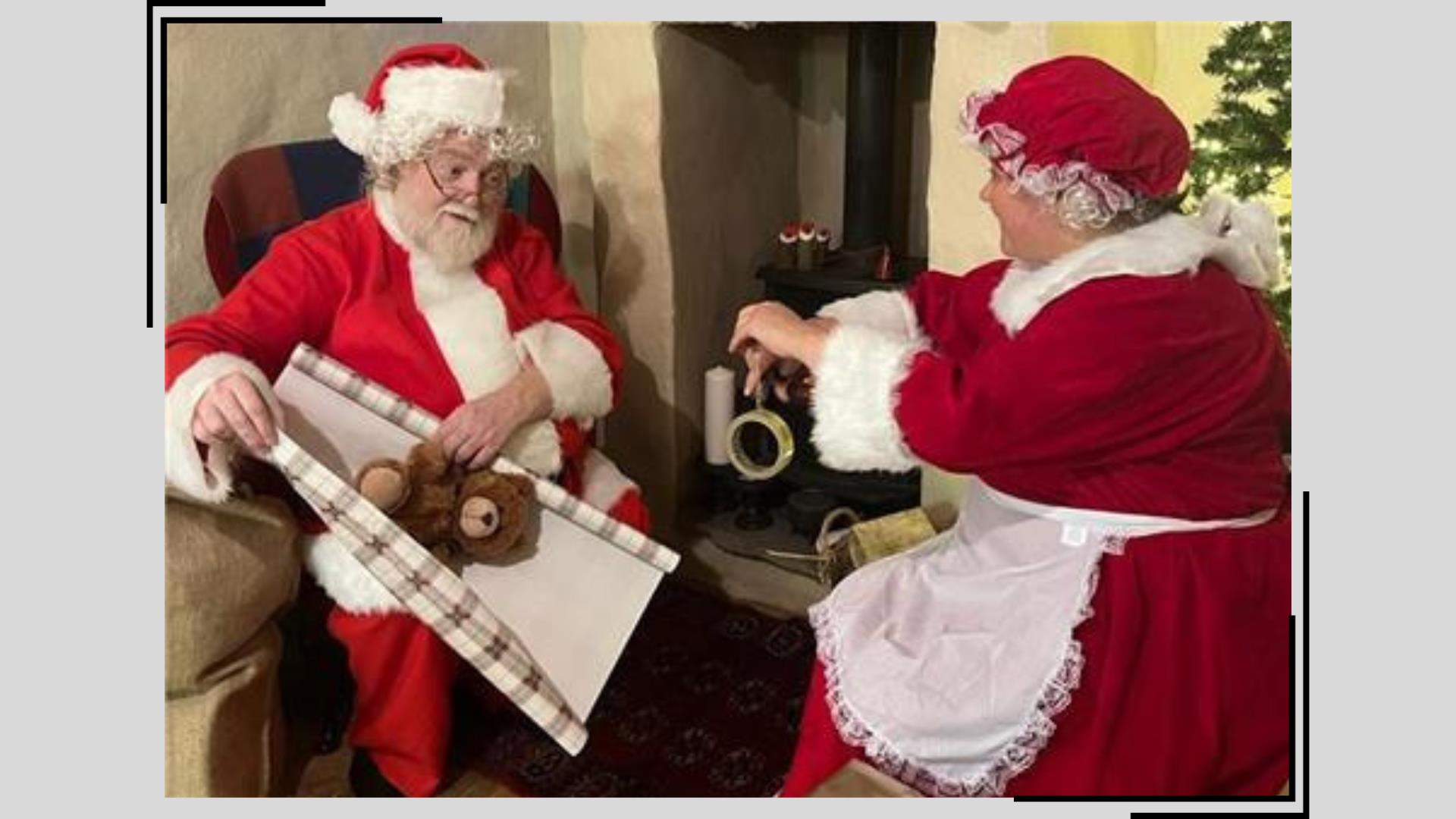 Santa and Mrs Claus wrap presents together