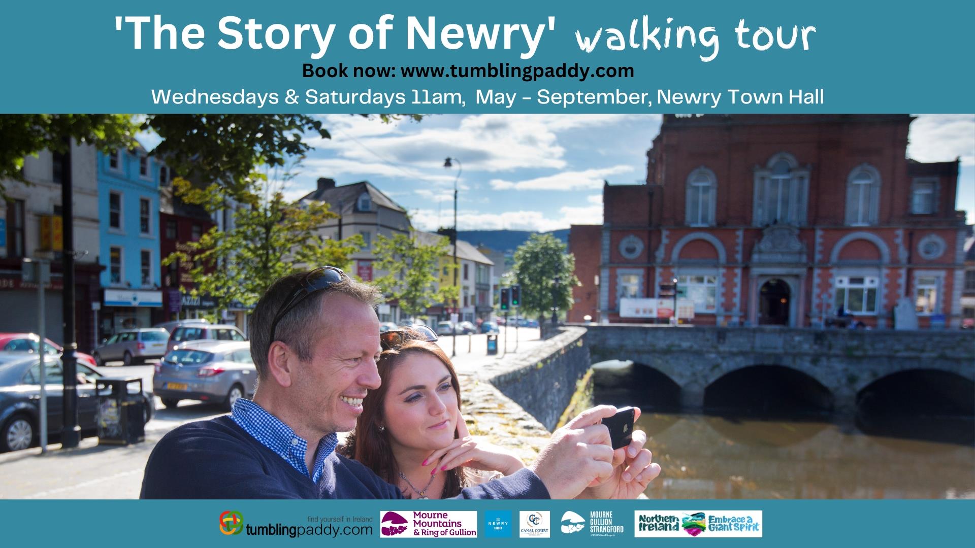 Image showing a couple stopping to take a selfie whilst enjoying the Story of Newry Walking Tour.