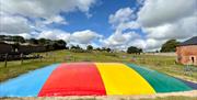 Outdoor bouncy pillow in the farm park field