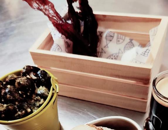 various seafood dishes sit on a table