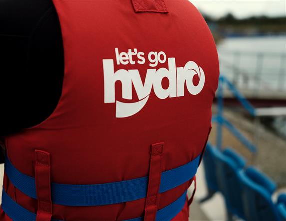 Image shows the Let's go Hydro logo on the back of a life jacket