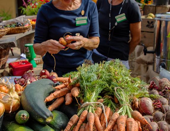Two women selling produce at market