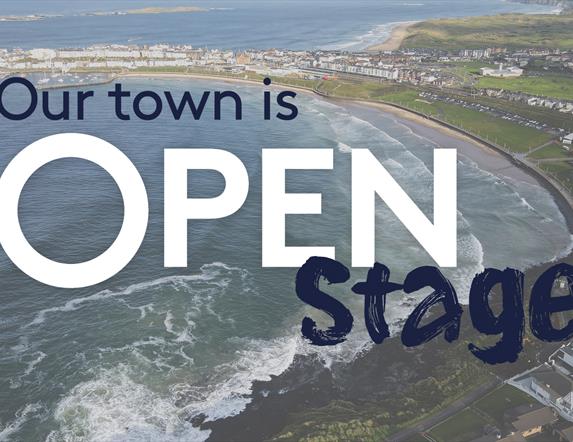text reads 'Our Town is Open stage' overlayed on an aerial image of Portrush
