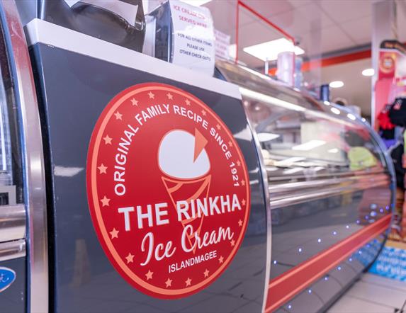 Ice cream serving counter with The Rinkha ice cream logo