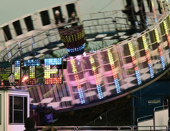 Circular amusement covered in bright lights