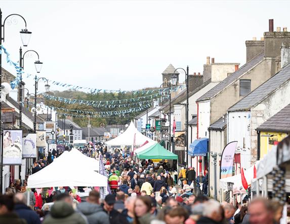 Crowds and stalls fill the main street in Bushmills