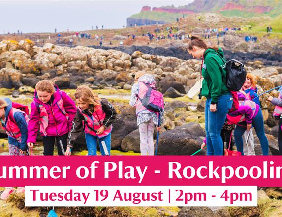 A group taking part in a rockpooling event in the bays of Port Ganny at the Giant's Causeway
