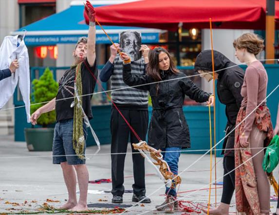 An image of performative artists outdoor