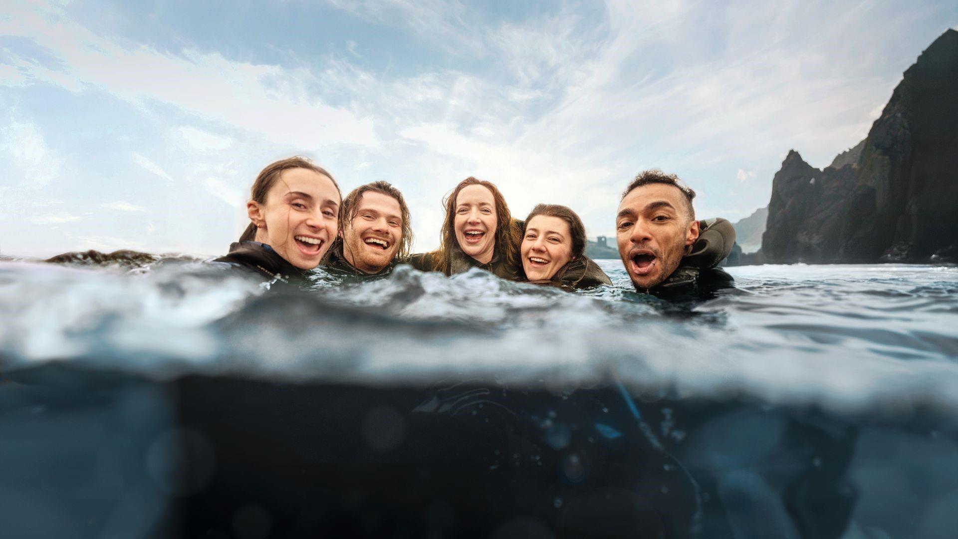 Group of 4 people in the water enjoying the activities at Aquaholics