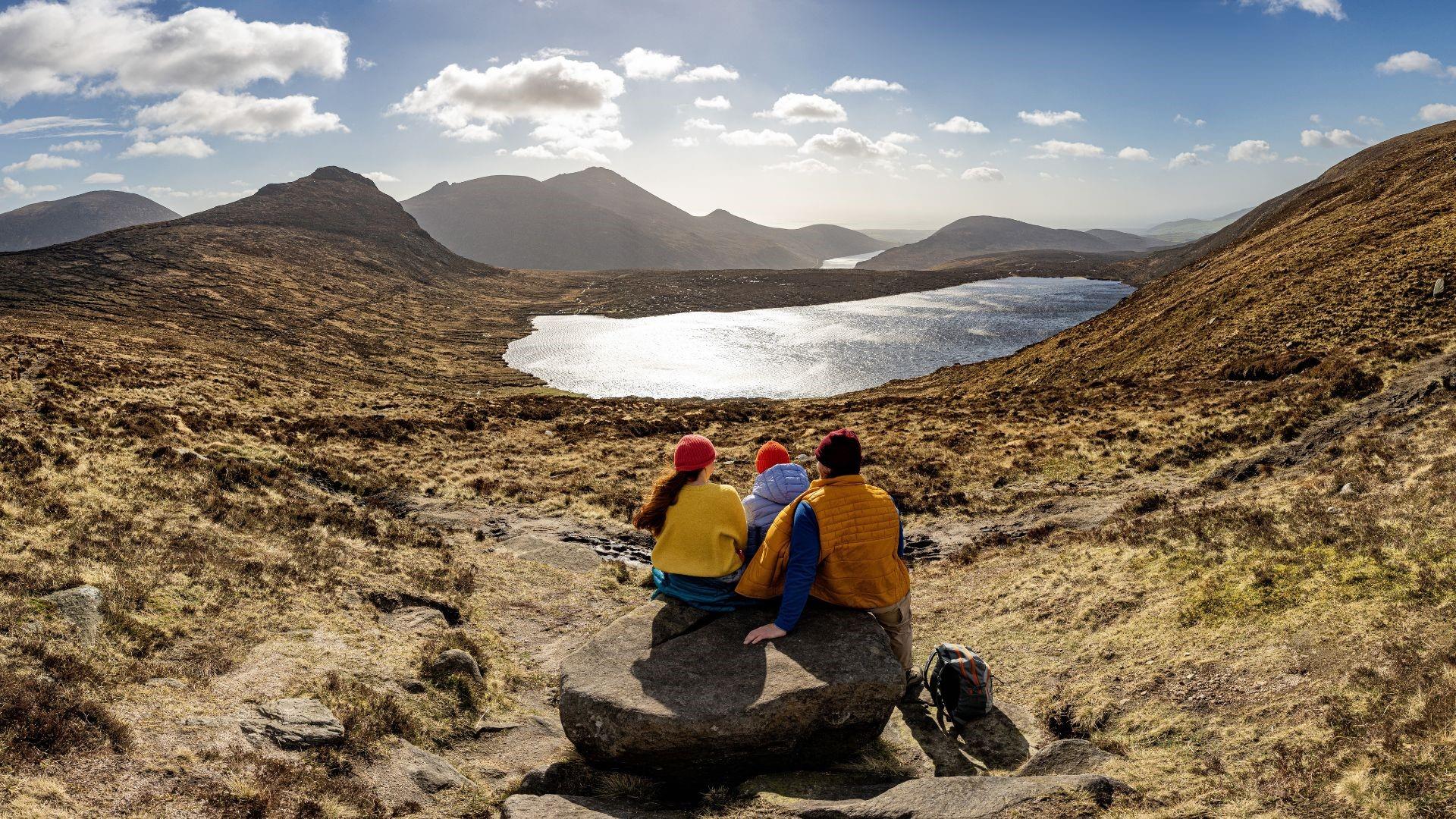 Group enjoying the view on a sunny day in the Mourne Mountains, County Down