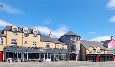 An exterior view of Walsh's Hotel in Maghera charming blend of traditional Irish architecture and modern touches. 