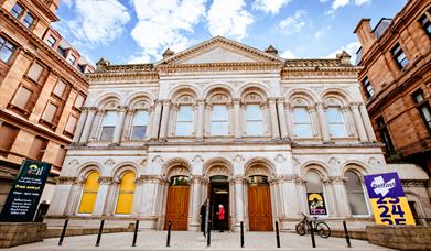 An image showing the exterior of an old bank converted into a creative space.