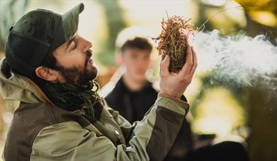 Bushman Rob making fire.