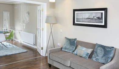 Image of sofa bedside double doors into dining area