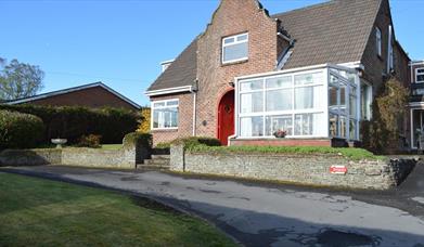 Image shows front of property and front drive way