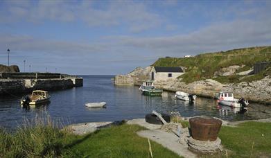 Small boats docked at Ballintoy Harbour