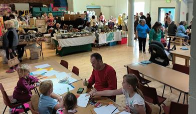 Hall filled with crafters and people undertaking activities