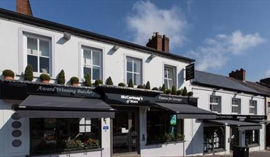 Image is of shop front facing out onto street