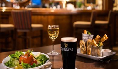 Food wine and Guinness on table