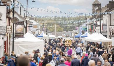 Crowds and stalls fill the main street in Bushmills