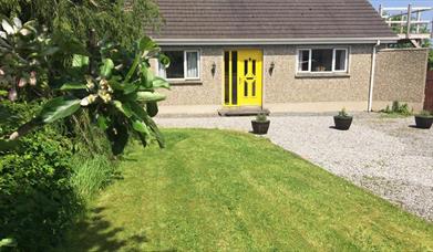 Outside image of house with yellow door