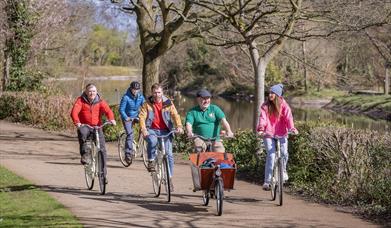 Steven from Hometown Tours guides 4 tourists along Belfast's beautiful riverside greenways as part of an urban bike tour