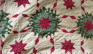 Close up of the star pattern on an Ulster American Folk Park Quilt