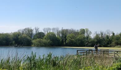 A fisherman casting his fishing line at Donaghaguy Waterworks.