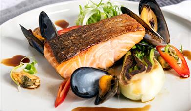 A plate of pan-seared Glenarm salmon, with Strangford Lough mussels and red chilli.