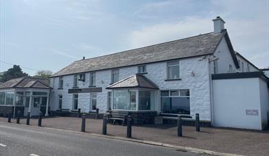 Whitewashed wall exterior of Halfway House Hotel in Ballygally