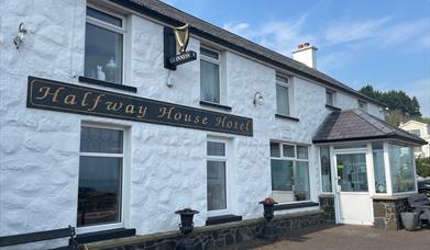 Whitewashed wall exterior of Halfway House Hotel in Ballygally