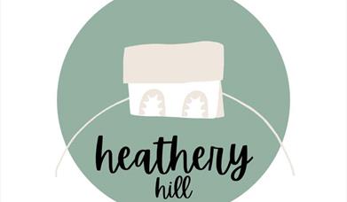 Images shows logo of heathery hill which is a small house within a green circle