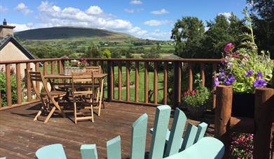 View of Knocklayde and al fresco dining area.