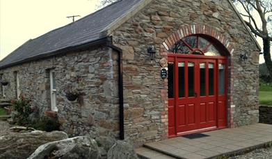 Mill Cottage showing red double doors