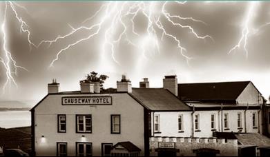 edited image of the Causeway Hotel with lightning forks in the sky above